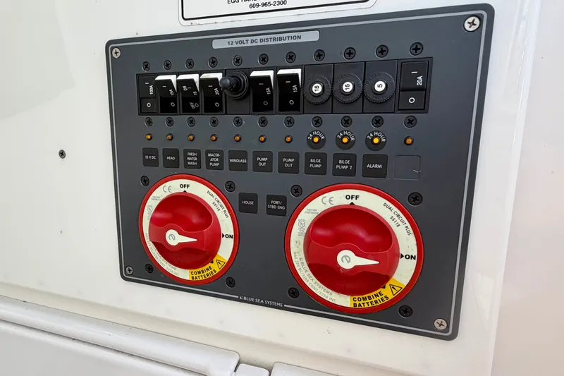 Slide: The Image of Electrical control panel with toggle switches and rotary knobs on a boat. - 19