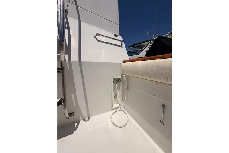 Slide: The Image of 1990 Californian 48 Motor Yacht deck with outdoor shower and railing. - 10