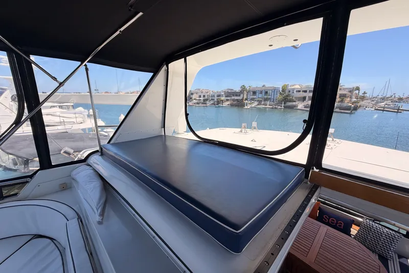 Slide: The Image of Interior view of 1990 Californian 48 Motor Yacht with marina backdrop. - 30