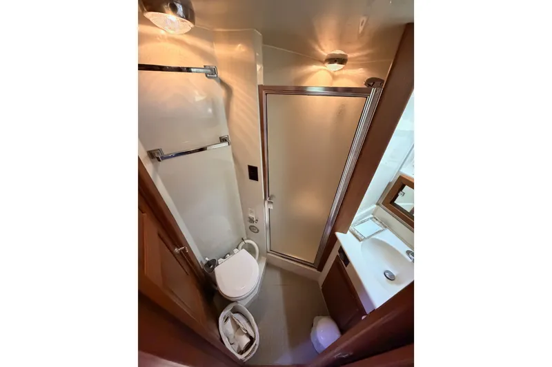 Slide: The Image of Bathroom interior of 1990 Californian 48 Motor Yacht with shower and sink. - 75