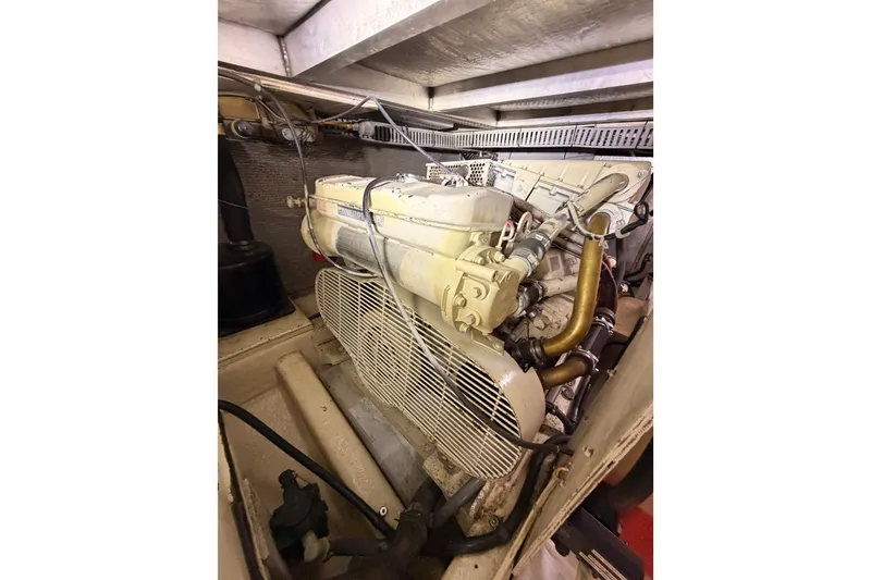 Slide: The Image of Engine room of a 1990 Californian 48 Motor Yacht, showcasing detailed machinery. - 110