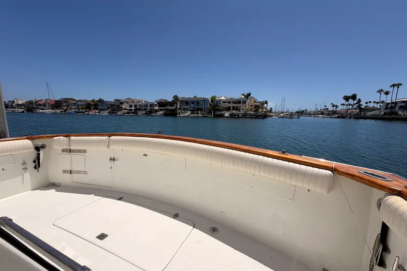 Slide: The Image of 1990 Californian 48 Motor Yacht deck overlooking marina with waterfront homes and clear blue sky. - 106