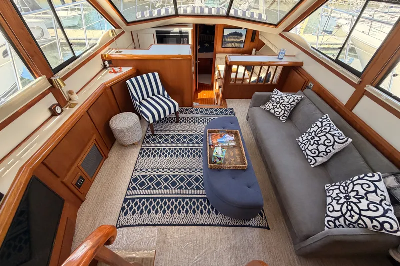 Slide: The Image of Luxurious interior of a 1990 Californian 48 Motor Yacht with elegant seating and nautical decor. - 55