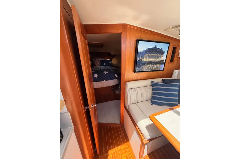 Slide: The Image of Interior of 1990 Californian 48 Motor Yacht with cozy seating and nautical decor. - 68