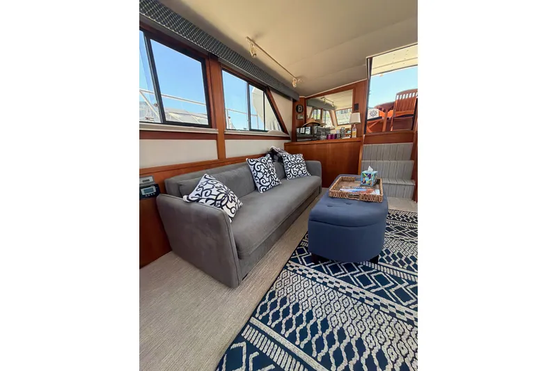 Slide: The Image of Luxurious interior of a 1990 Californian 48 Motor Yacht with elegant seating and decor. - 86