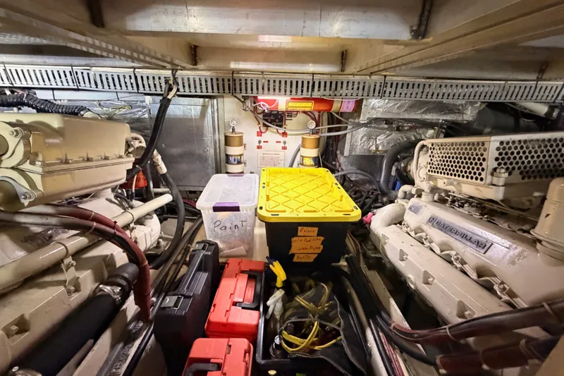Slide: The Image of Engine room of a 1990 Californian 48 Motor Yacht with organized storage and equipment. - 113