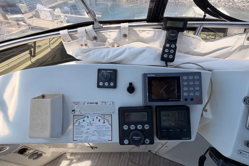 Slide: The Image of Control panel of a 1990 Californian 48 Motor Yacht with navigation instruments. - 47