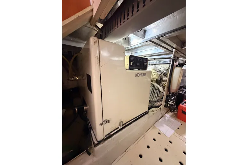 Slide: The Image of Engine room of 1990 Californian 48 Motor Yacht with Kohler generator. - 107