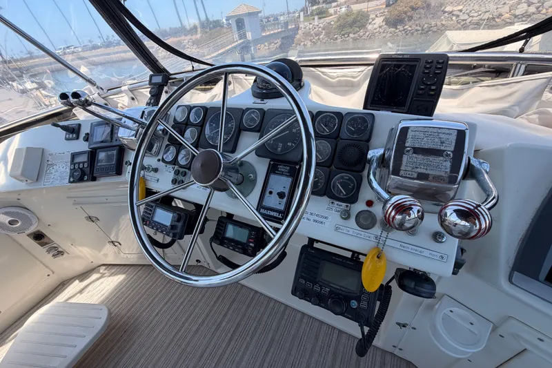 Slide: The Image of Cockpit of 1990 Californian 48 Motor Yacht with steering wheel and navigation instruments. - 40