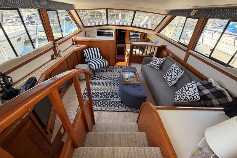 Slide: The Image of Luxurious interior of a 1990 Californian 48 Motor Yacht with elegant seating and decor. - 54