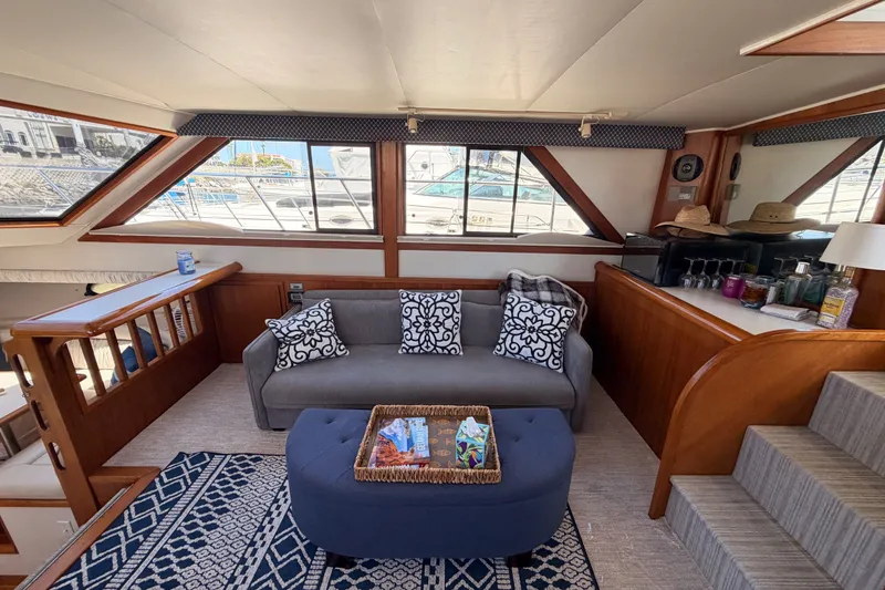Slide: The Image of Luxurious interior of a 1990 Californian 48 Motor Yacht with elegant seating and decor. - 56