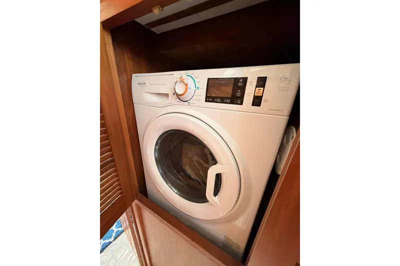 Slide: The Image of Washing machine inside 1990 Californian 48 Motor Yacht wooden cabinet. - 93