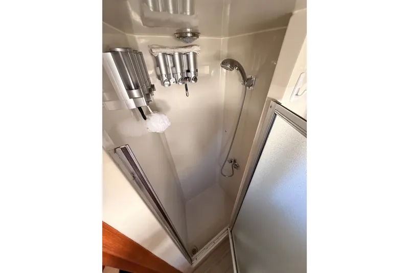 Slide: The Image of Shower area in 1990 Californian 48 Motor Yacht with dispensers and handheld showerhead. - 103