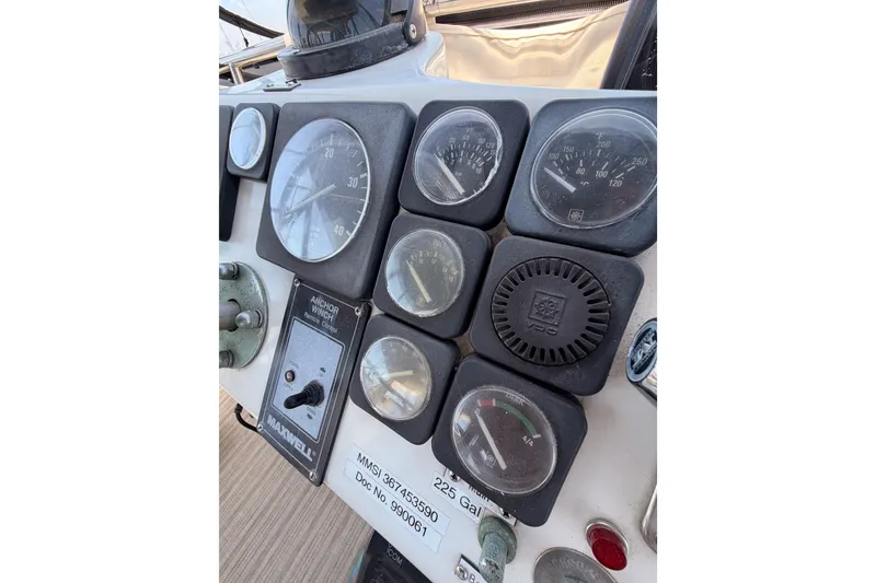 Slide: The Image of Control panel of a 1990 Californian 48 Motor Yacht with various gauges and switches. - 45