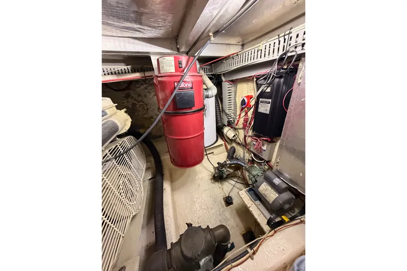 Slide: The Image of Engine room of 1990 Californian 48 Motor Yacht with machinery and wiring. - 112