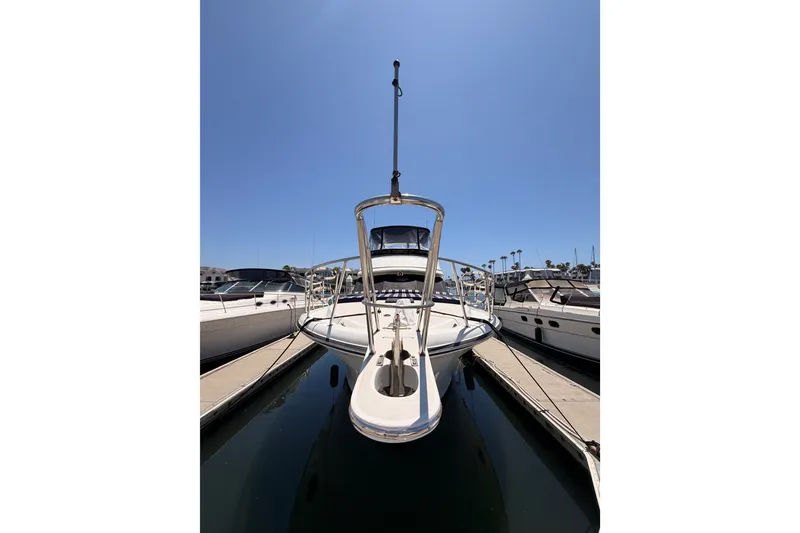 Slide: The Image of Front view of a 1990 Californian 48 Motor Yacht docked at a marina. - 3