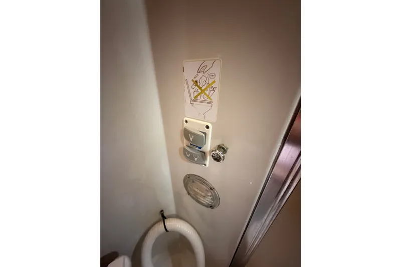 Slide: The Image of Toilet controls and instructions inside a 1990 Californian 48 Motor Yacht bathroom. - 78