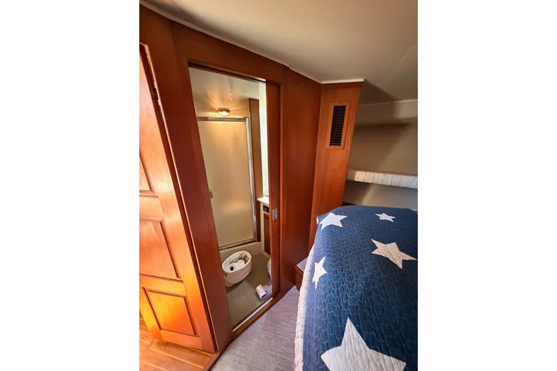 Slide: The Image of Interior of 1990 Californian 48 Motor Yacht with cozy bedroom and ensuite bathroom. - 74