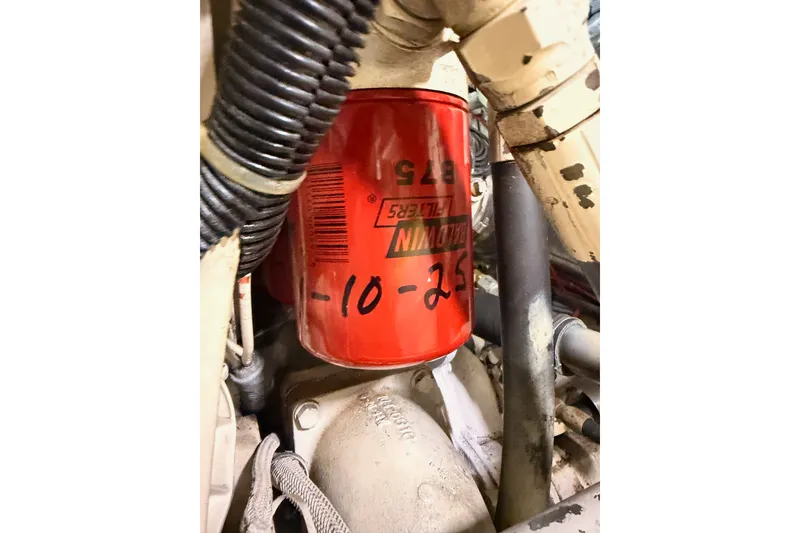Slide: The Image of Engine compartment of 1990 Californian 48 Motor Yacht with visible oil filter. - 121