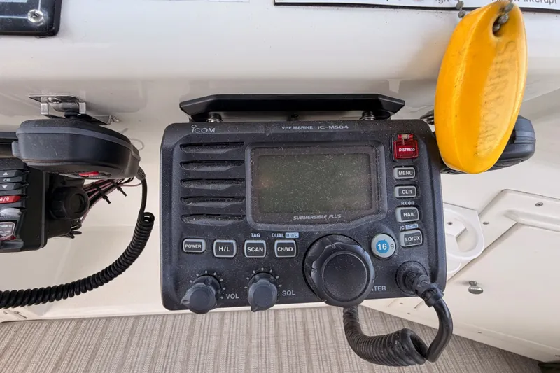 Slide: The Image of VHF marine radio on 1990 Californian 48 Motor Yacht dashboard. - 42