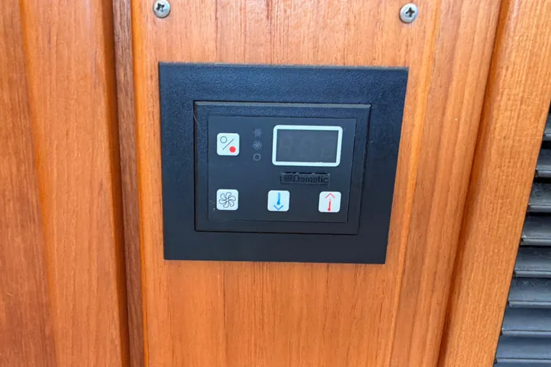 Slide: The Image of Control panel on 1990 Californian 48 Motor Yacht wooden interior. - 90