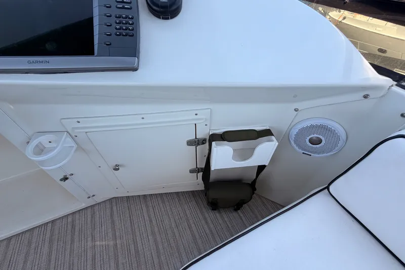 Slide: The Image of Interior of 1990 Californian 48 Motor Yacht with Garmin device and speaker. - 38