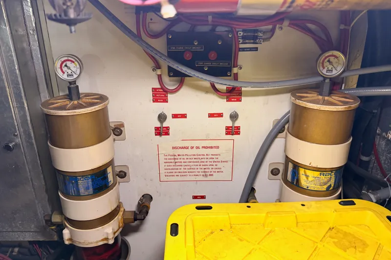 Slide: The Image of Engine room of 1990 Californian 48 Motor Yacht with fuel filters and gauges. - 118
