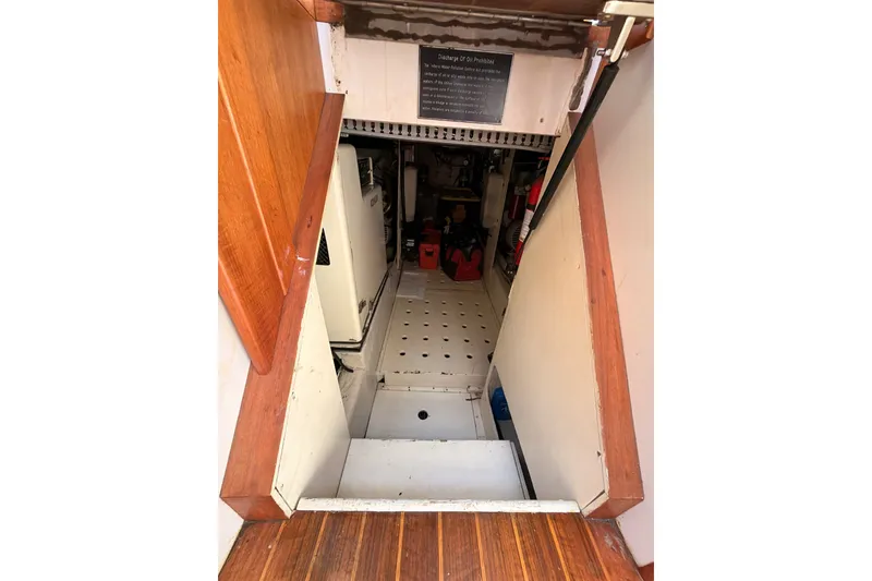 Slide: The Image of Engine room entrance of 1990 Californian 48 Motor Yacht with wooden trim. - 83