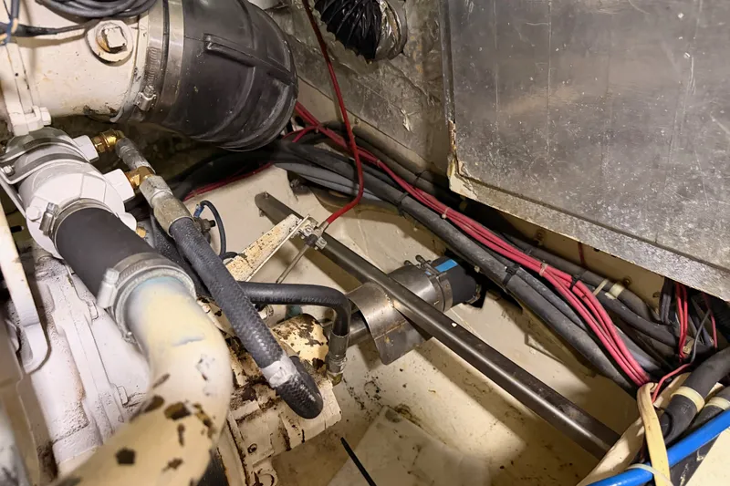 Slide: The Image of Engine room of a 1990 Californian 48 Motor Yacht with visible wiring and components. - 120