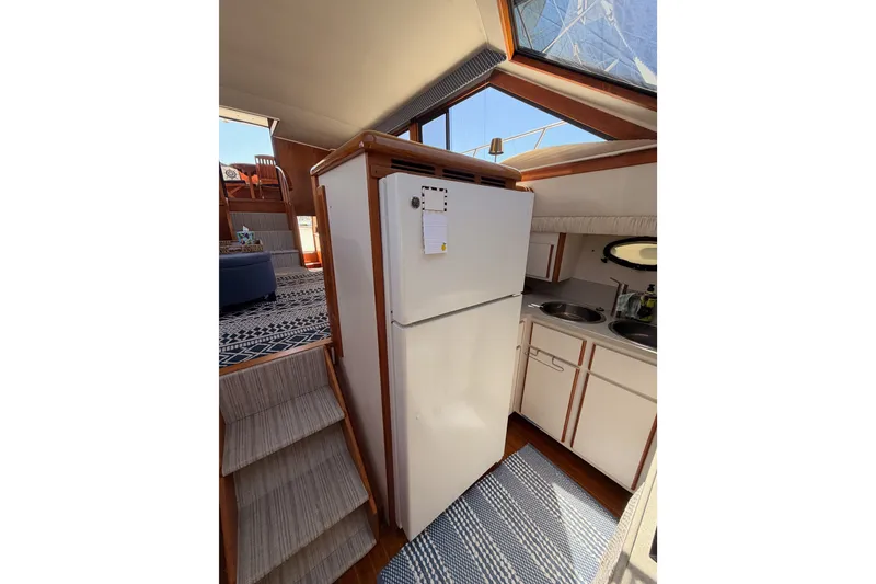 Slide: The Image of Interior of 1990 Californian 48 Motor Yacht kitchen with fridge and sink. - 66