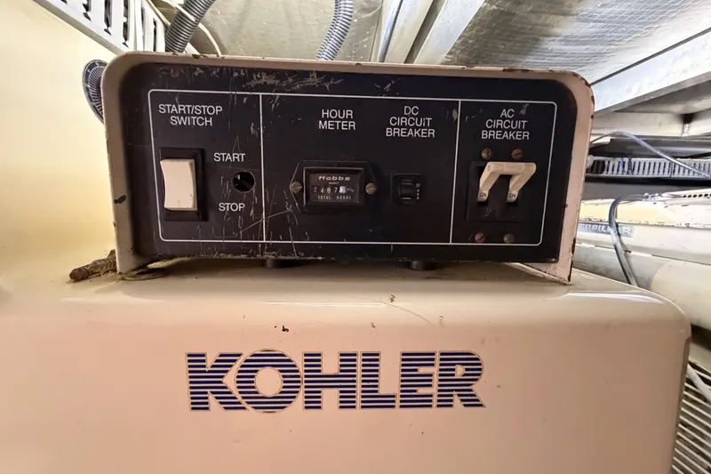 Slide: The Image of Control panel of a Kohler generator on a 1990 Californian 48 Motor Yacht. - 108