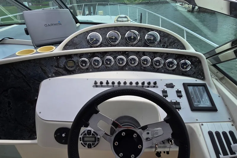 Slide: The Image of Cockpit of 2000 Wellcraft 45 Excalibur with Garmin navigation system and control panel. - 13