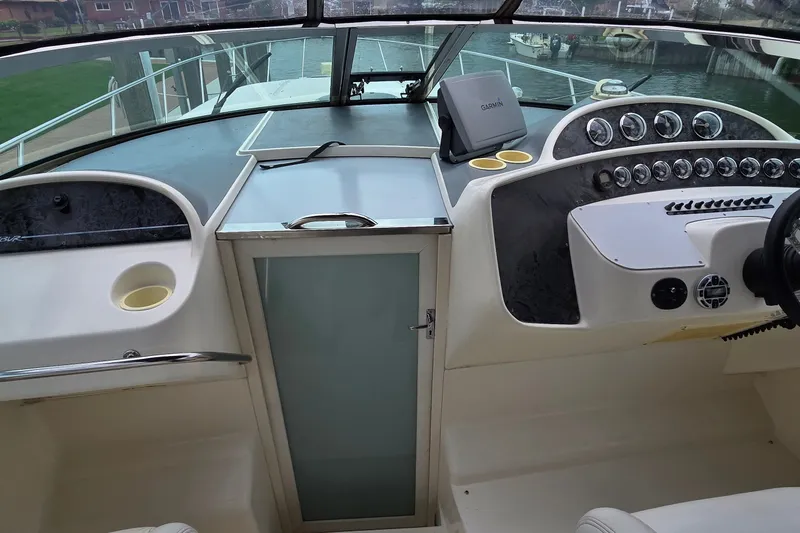 Slide: The Image of Cockpit of 2000 Wellcraft 45 Excalibur with Garmin navigation system and control panel. - 16