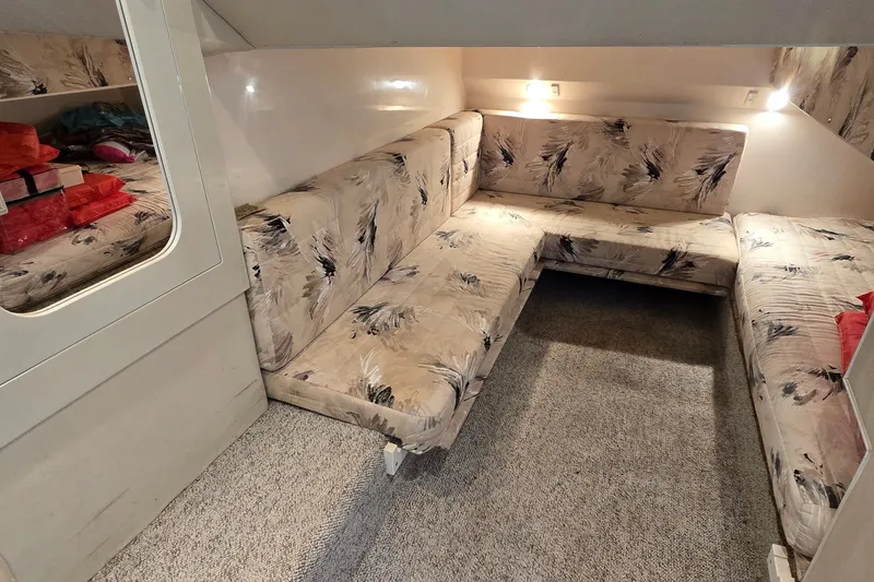 Slide: The Image of Interior of 2000 Wellcraft 45 Excalibur with patterned seating and soft lighting. - 17