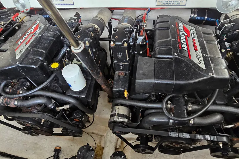 Slide: The Image of Twin MerCruiser engines in a 2000 Wellcraft 45 Excalibur boat engine room. - 42