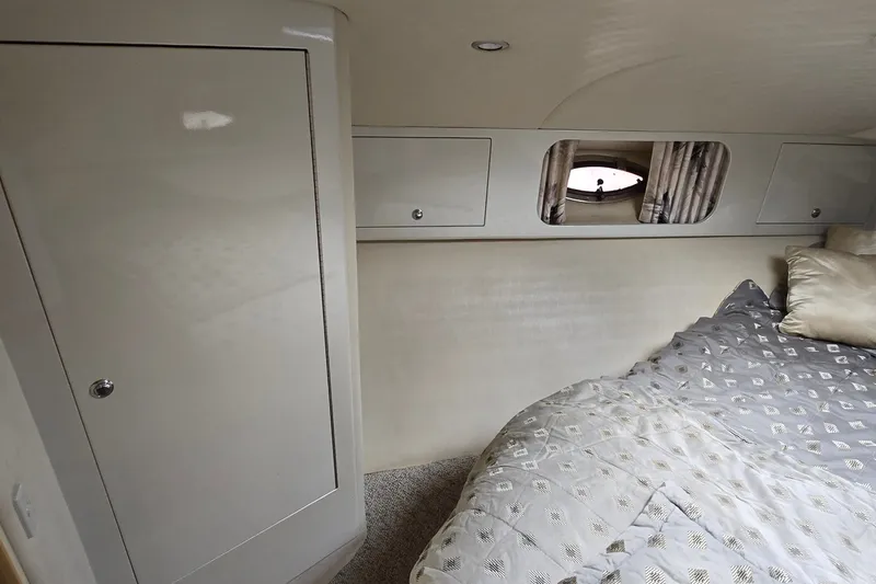 Slide: The Image of Interior cabin of 2000 Wellcraft 45 Excalibur with bed and storage cabinets. - 27
