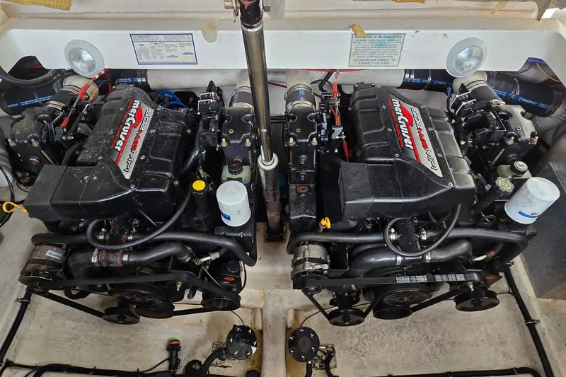 Slide: The Image of Engine compartment of a 2000 Wellcraft 45 Excalibur with twin MerCruiser engines. - 36