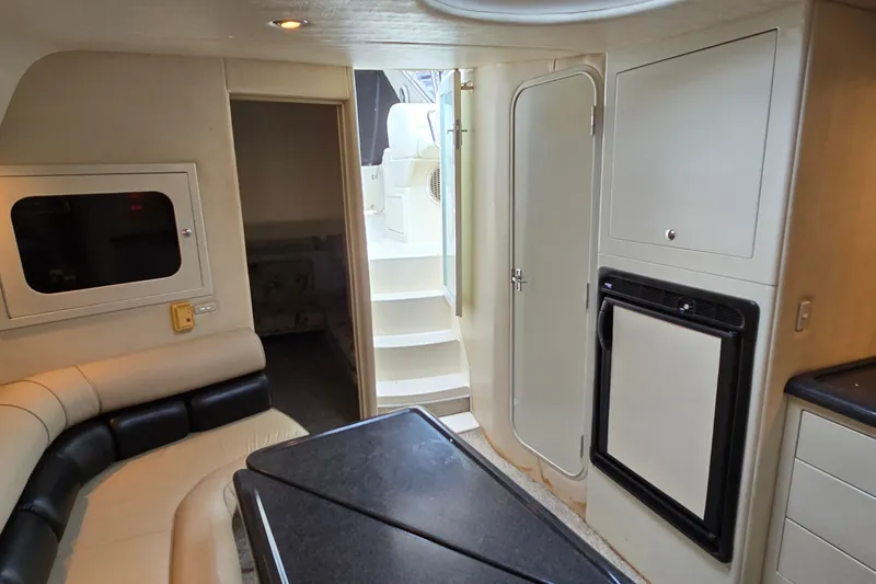 Slide: The Image of Interior of 2000 Wellcraft 45 Excalibur yacht with seating, stairs, and cabinetry. - 24