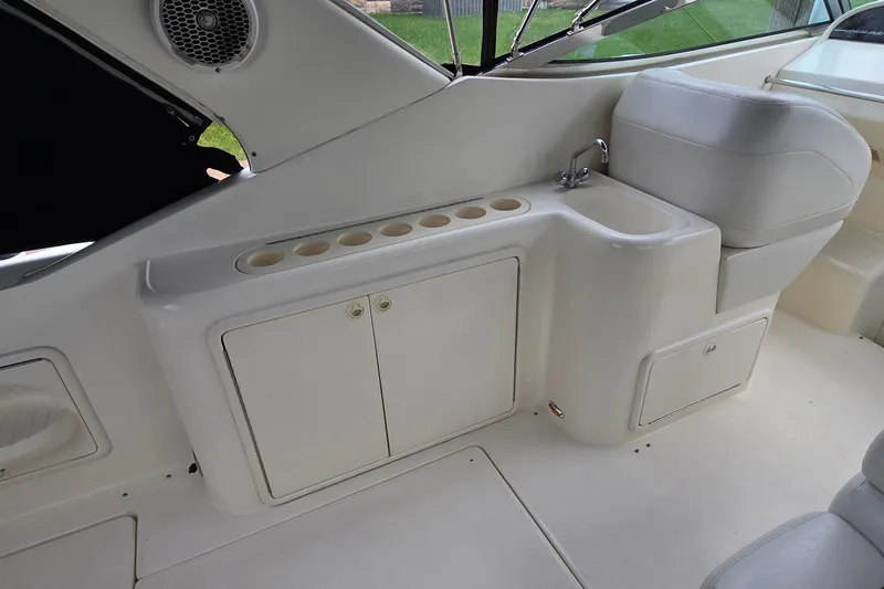 Slide: The Image of Interior of 2000 Wellcraft 45 Excalibur boat with sink and storage cabinets. - 8