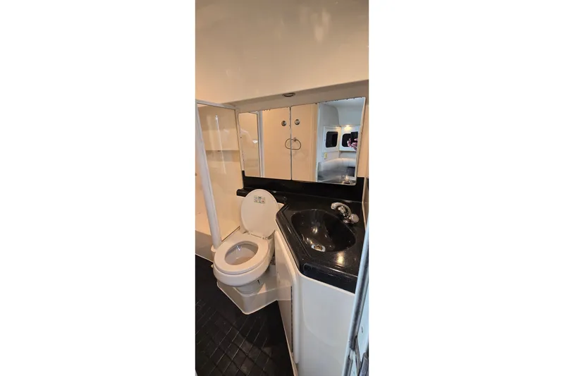 Slide: The Image of Bathroom interior of 2000 Wellcraft 45 Excalibur yacht with toilet and sink. - 33