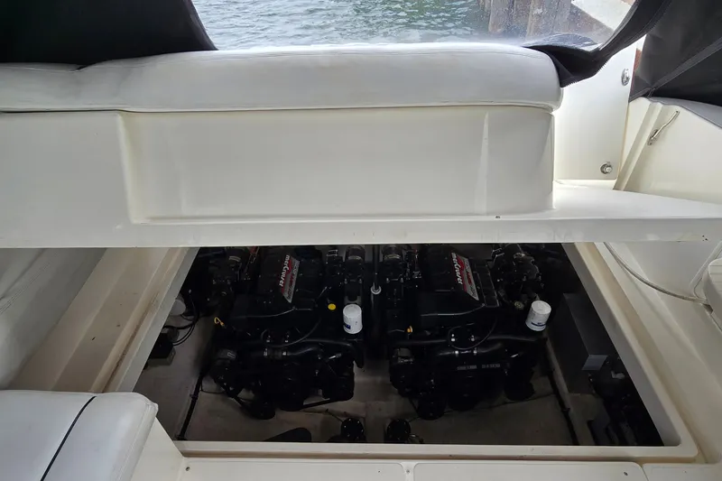 Slide: The Image of Engine compartment of 2000 Wellcraft 45 Excalibur boat, featuring dual MerCruiser engines. - 43