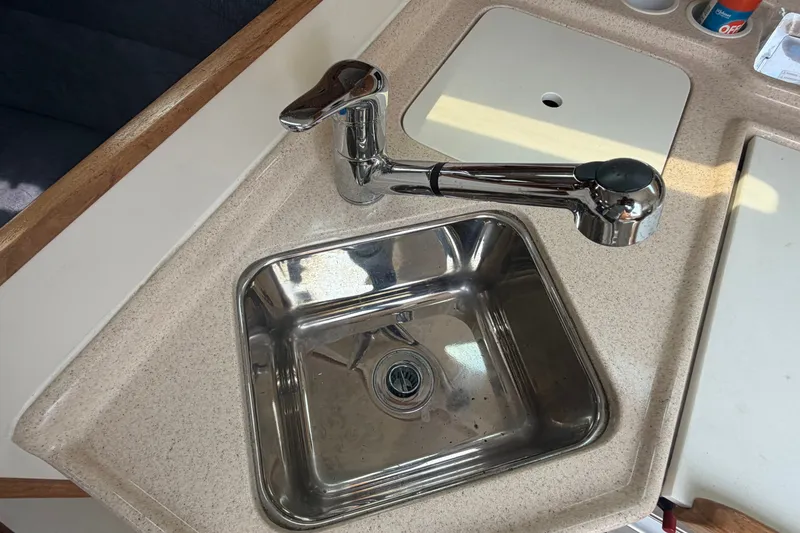 Slide: The Image of Stainless steel sink and faucet in 2003 Catalina 28 MkII boat galley. - 25