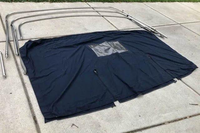 Slide: The Image of Bimini top and frame for 2003 Catalina 28 MkII sailboat on pavement. - 27