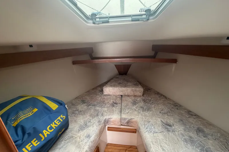 Slide: The Image of Interior cabin of 2003 Catalina 28 MkII sailboat with life jackets and bedding. - 21