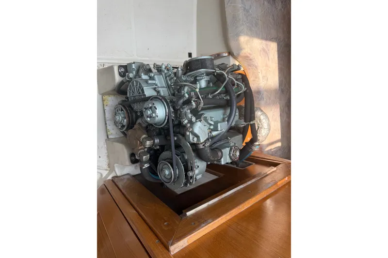 Slide: The Image of Engine of a 2003 Catalina 28 MkII sailboat, showcasing mechanical components. - 13