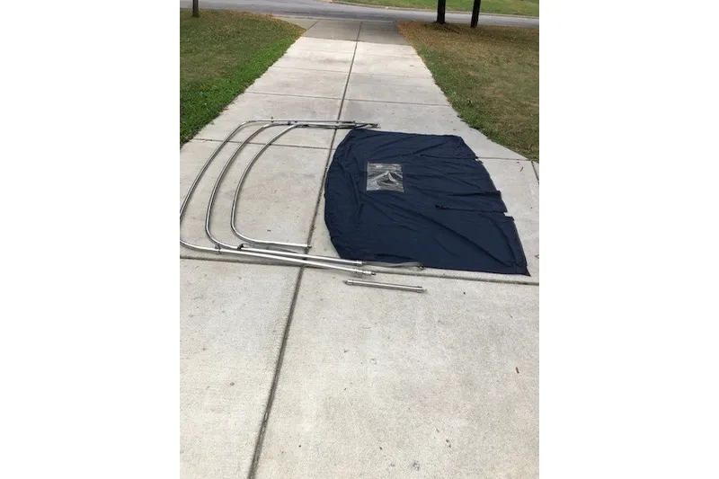 Slide: The Image of Catalina 28 MkII 2003 sailboat bimini frame and canvas on driveway. - 28