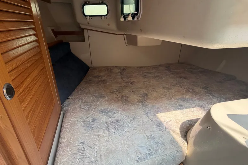 Slide: The Image of Interior cabin of 2003 Catalina 28 MkII sailboat with cozy sleeping area. - 23