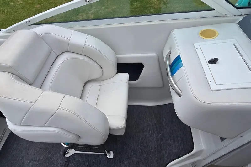 Slide: The Image of White interior seating of a 1995 Powerquest 290 Enticer boat. - 12