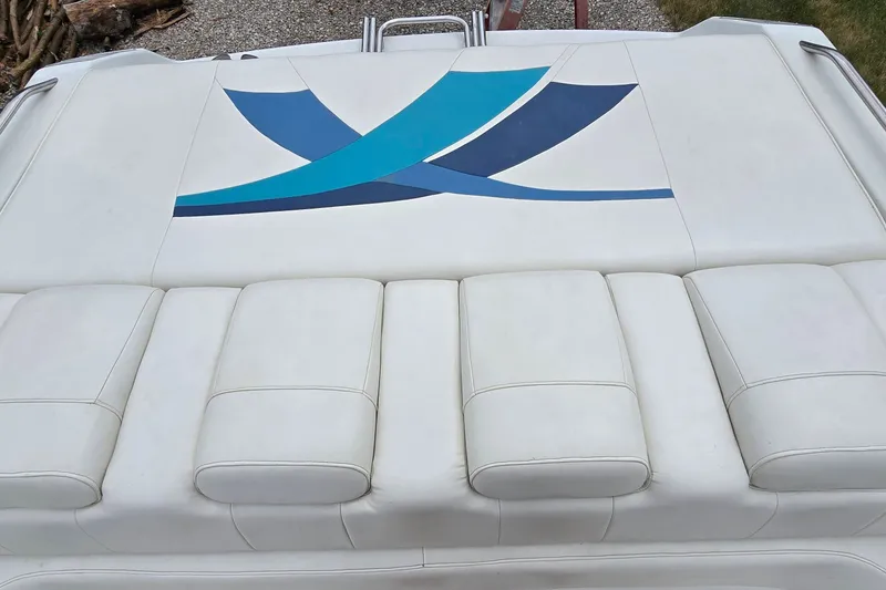 Slide: The Image of White leather seating with blue design on a 1995 Powerquest 290 Enticer boat. - 10