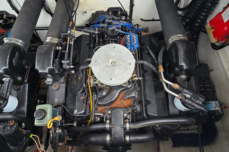 Slide: The Image of 1995 Powerquest 290 Enticer engine compartment with visible components and wiring. - 24
